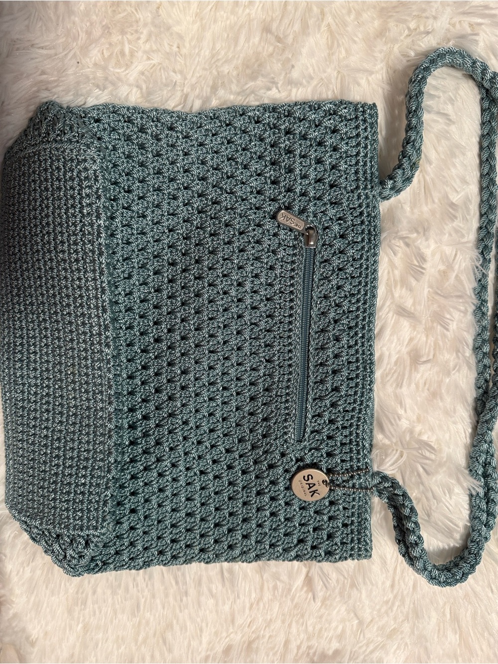 The Sak Teal Crochet Two Strap Shoulder Bag with Braided Strap.